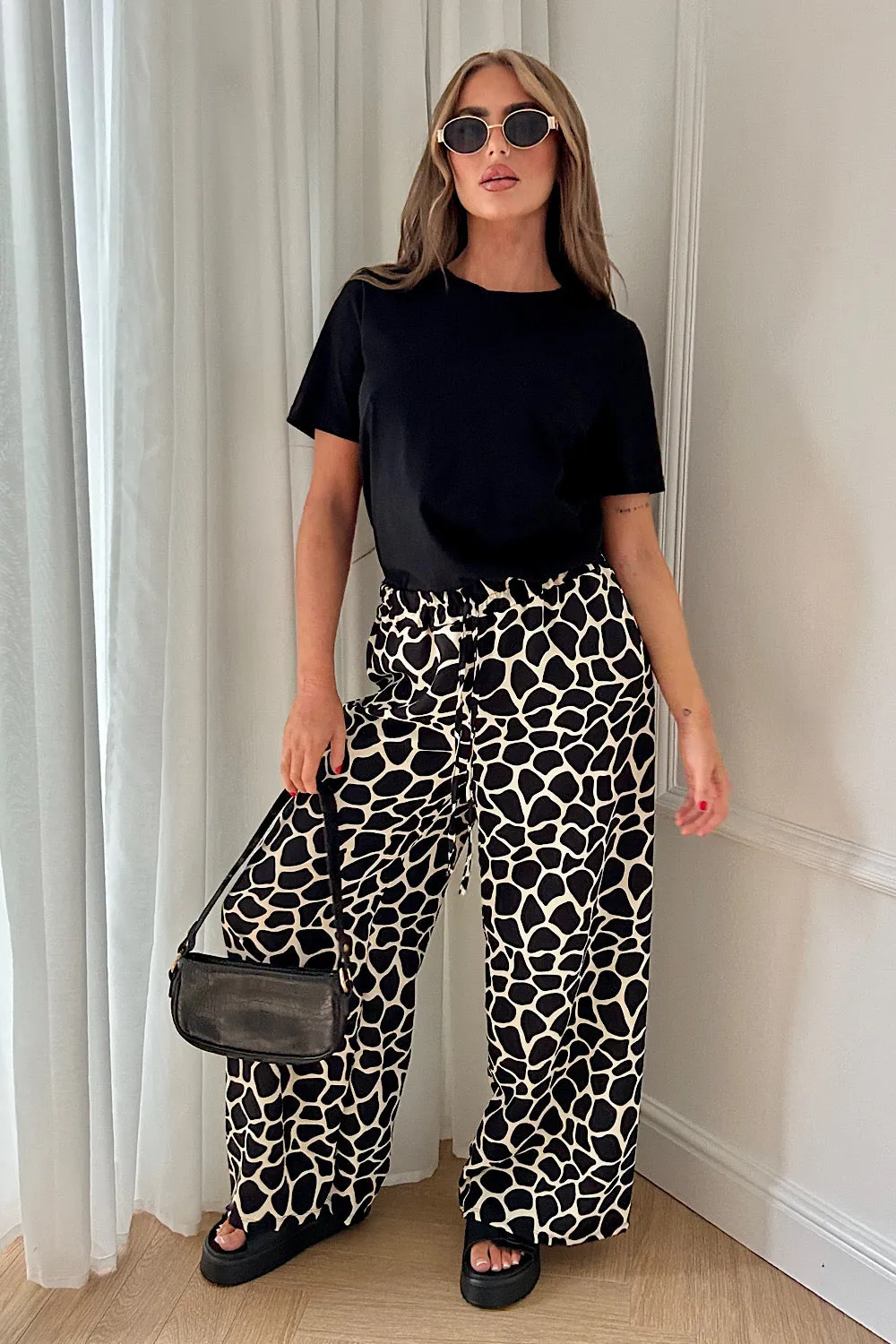 Shannon Black Giraffe Print Flared Trousers